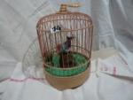 Cage à oiseaux bakélite/plastique écru base ronde, les barreaux en...