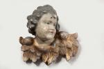 ECOLE ITALIENNE XVIIIe siècle. Tête d'angelot en bois polychrome et...