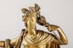 Importante PENDULE en bronze doré à décor d'Apollon assis sur...