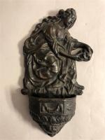 BENITIER en bronze à patine noire à décor de Marie-Madeleine....