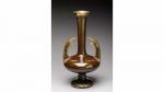 Delphin MASSIER (1836-1907). Vase soliflore d'inspiration mauresque en céramique brune...