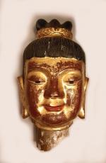 Tête de Bouddha en céramique laquée sur son socle en...