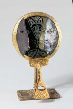 Jean Cocteau (1889-1963). Rare miroir de table en bronze doré...