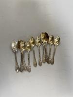 12 petites CUILLERES en argent doré à rare décor de...