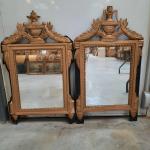 Deux MIROIRS en bois stuqué doré de style Louis XVI,...