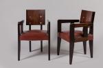André Sornay (1902-2000)
Paire de fauteuils en palissandre clouté à dossier...