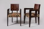 André Sornay (1902-2000)
Paire de fauteuils en palissandre clouté à dossier...