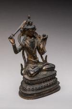 Statuette en bronze anciennement laqué et doré, représentant Manjusri assis...