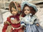 2 jolies poupées tête bakélite, rhodoïd, dont 
-l'1 marquée à...