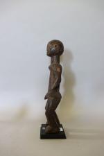 Nigeria : Statuette Montol en bois dur à patine brun...