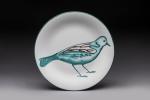 Robert Picault (1919-2000)
Assiette en céramique blanche à décor d'oiseau dans...