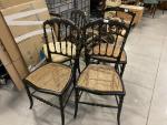 Quatre chaises de deux modèles différents en bois noirci, dont...