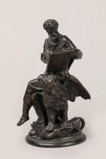 "Saint Marc" en bronze à patine brune. Assis sur son...