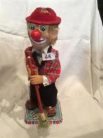 Le clown-balayeur, battery-toy "Rosko tested"en tôle lithographiée, tête et mains...