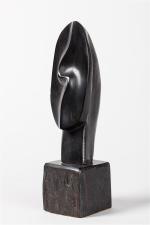 Alexandre Noll (1890-1970)Sculpture " Tête " en ébène. Signée. H....