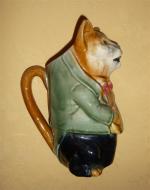 Orchies
Pichet en céramique polychrome à décor de chat musicien. Oreille...