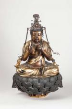 SUJET en bois laqué or et noir représentant un Bouddha...
