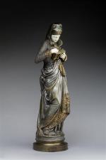 Ernest CARRIER-BELLEUSE (1824-1887) "Liseuse". Bronze à patine polychrome et ivoire....