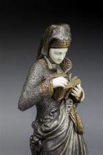 Ernest CARRIER-BELLEUSE (1824-1887) "Liseuse". Bronze à patine polychrome et ivoire....