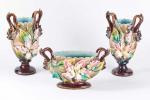 Ensemble de trois vases en céramique polychrome à décor floral...