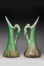 Delphin MASSIER (1836-1907). Paire d'aiguières en céramique verte à nuances...